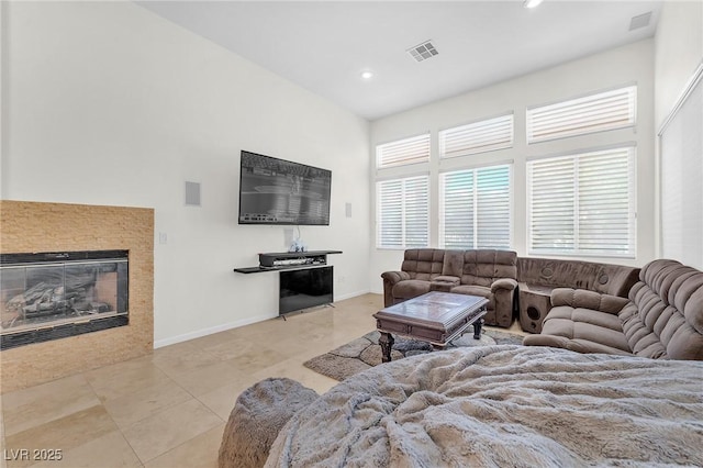 465 Indigo Springs St, Henderson, NV 89014 - living area featuring tile patterned floors, recessed lighting, a tile fireplace, and visible vents