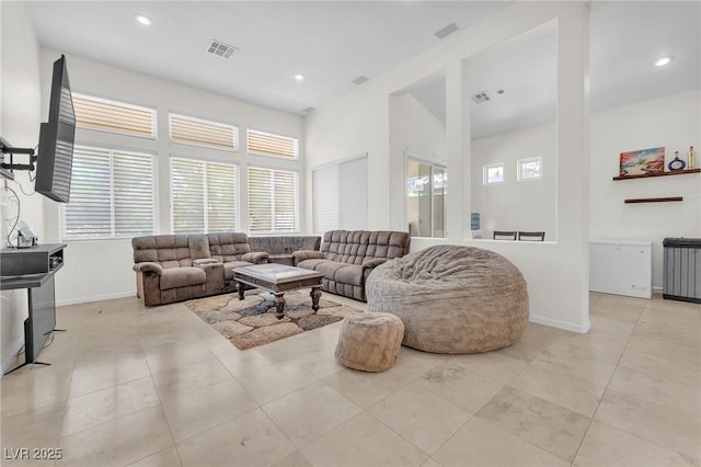 465 Indigo Springs St, Henderson, NV 89014 - living room featuring plenty of natural light, recessed lighting, baseboards, and radiator heating unit