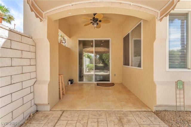 465 Indigo Springs St, Henderson, NV 89014 - doorway to property featuring ceiling fan, a patio area, and stucco siding