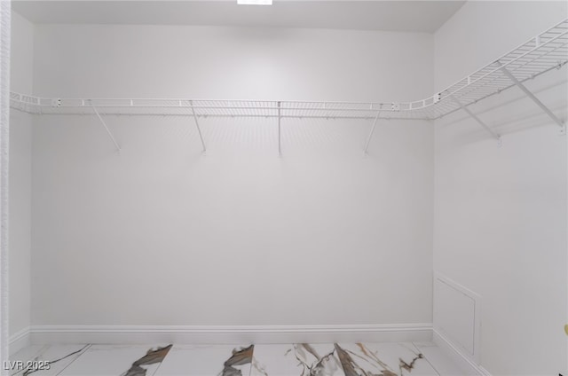 7526 Gossamer Wind St, Las Vegas, NV 89139 - spacious closet featuring light marble finish floors