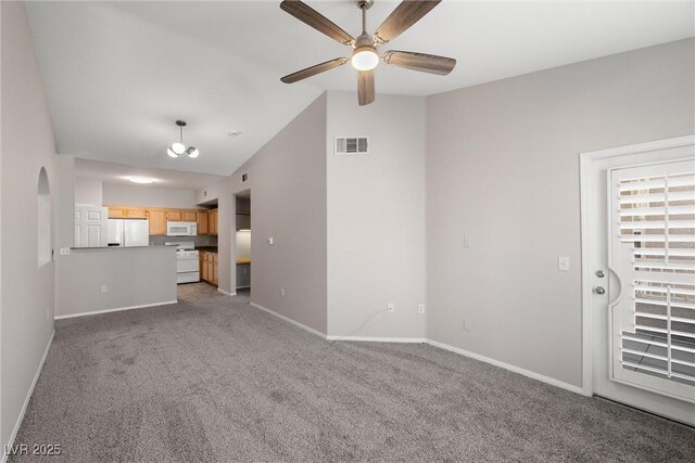10001 Peace Way Unit 2228, Las Vegas, NV 89147 - unfurnished living room featuring ceiling fan, baseboards, carpet flooring, and vaulted ceiling