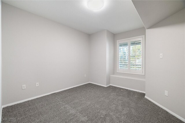 10001 Peace Way Unit 2228, Las Vegas, NV 89147 - spare room with dark colored carpet and baseboards