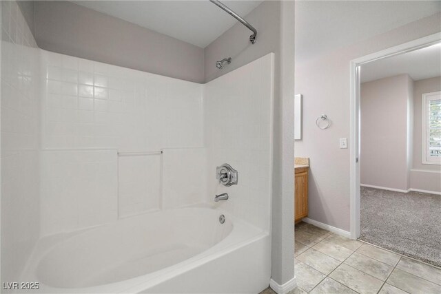 10001 Peace Way Unit 2228, Las Vegas, NV 89147 - full bath featuring  shower combination, vanity, tile patterned flooring, and baseboards