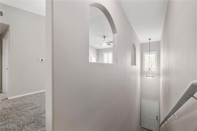 10001 Peace Way Unit 2228, Las Vegas, NV 89147 - corridor featuring arched walkways, carpet floors, and baseboards