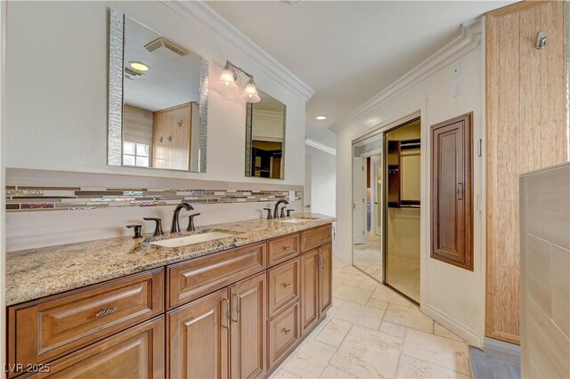 2708 Port Of Call Dr, Las Vegas, NV 89128 - full bath with crown molding, stone tile flooring, double vanity, decorative backsplash, and baseboards