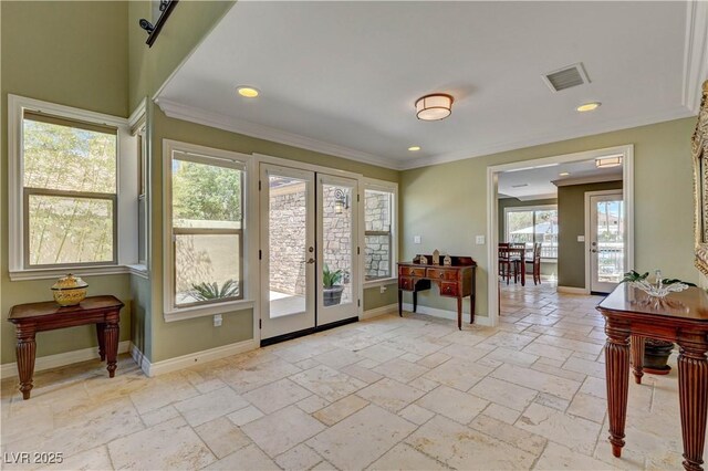 entryway with visible vents, french doors, and baseboards