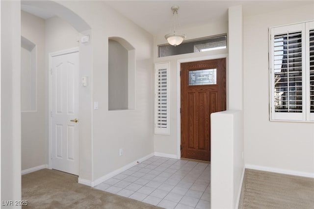 240 Jumping Springs Pl, Henderson, NV 89012 - entrance foyer featuring arched walkways, baseboards, and light colored carpet