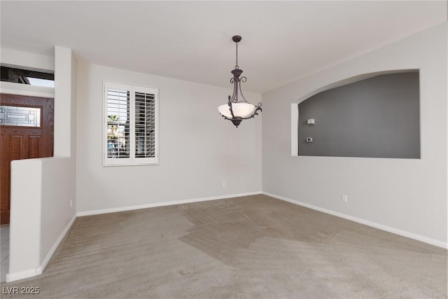 240 Jumping Springs Pl, Henderson, NV 89012 - empty room featuring carpet flooring, baseboards, and arched walkways