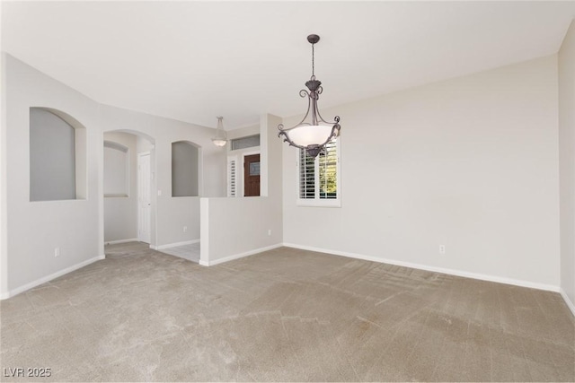 240 Jumping Springs Pl, Henderson, NV 89012 - unfurnished room featuring carpet floors, baseboards, and arched walkways