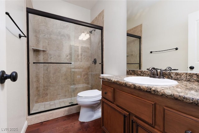 240 Jumping Springs Pl, Henderson, NV 89012 - bathroom with a shower stall, wood finished floors, vanity, and toilet