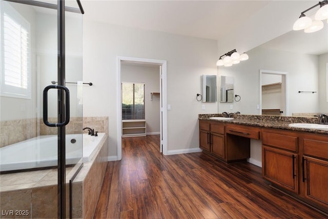 240 Jumping Springs Pl, Henderson, NV 89012 - full bath with a garden tub, double vanity, and wood finished floors