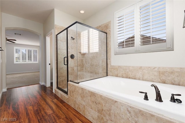 240 Jumping Springs Pl, Henderson, NV 89012 - full bath featuring a shower stall, wood finished floors, a garden tub, and baseboards