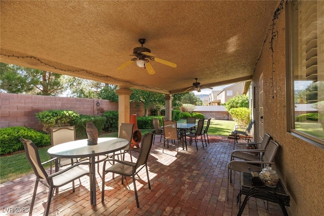 240 Jumping Springs Pl, Henderson, NV 89012 - view of patio / terrace featuring outdoor dining area, a fenced backyard, and ceiling fan