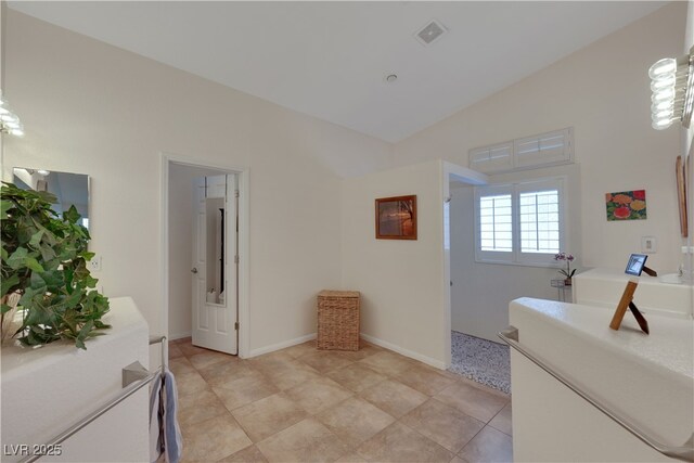 interior space with walk in shower, visible vents, a washtub, and high vaulted ceiling