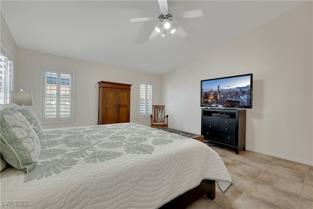 bedroom featuring light tile patterned floors, a ceiling fan, multiple windows, and lofted ceiling