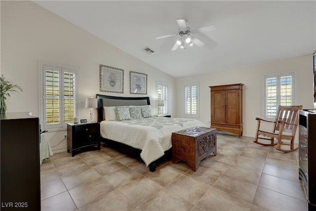 bedroom featuring multiple windows, baseboards, vaulted ceiling, and visible vents