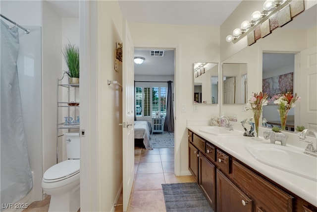full bath featuring visible vents, toilet, tile patterned flooring, and a sink