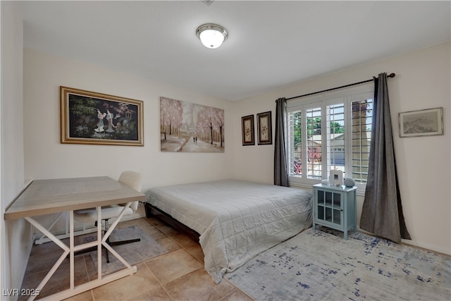 bedroom featuring baseboards