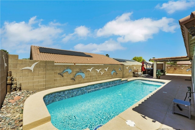 view of swimming pool featuring a fenced in pool, a patio area, and a fenced backyard