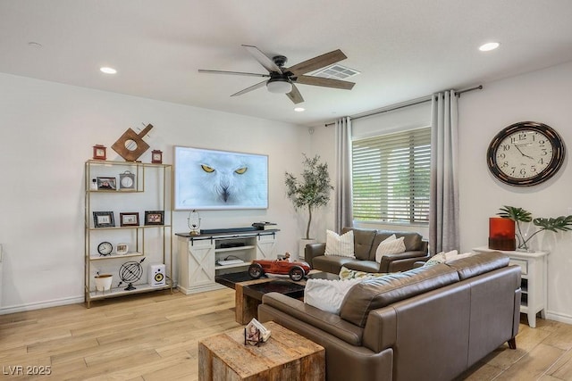 living room featuring ceiling fan, recessed lighting, visible vents, and light wood-style floors