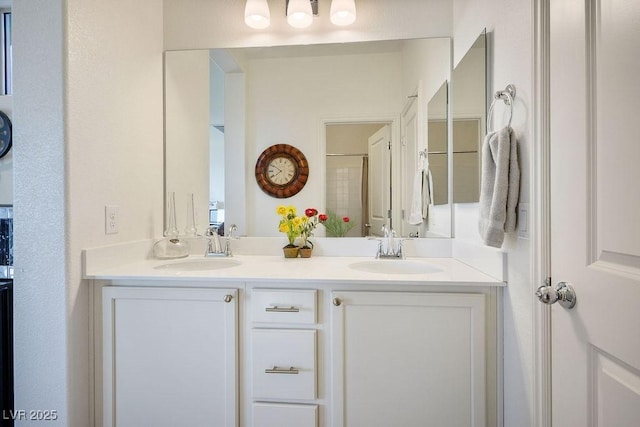 bathroom with double vanity and a sink