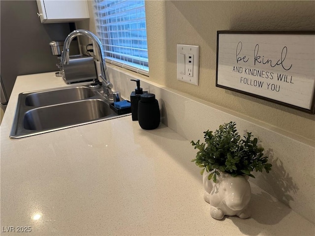 11257 Rainbow Peak Ave Unit 201, Las Vegas, NV 89135 - room details featuring white cabinetry, light countertops, and a sink