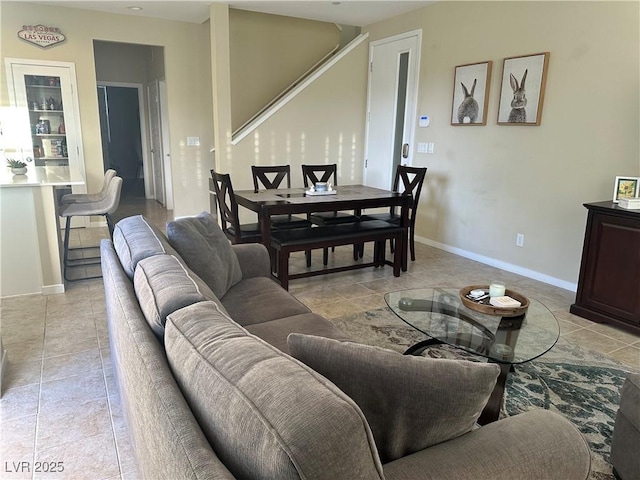 11257 Rainbow Peak Ave Unit 201, Las Vegas, NV 89135 - living room featuring light tile patterned flooring and baseboards