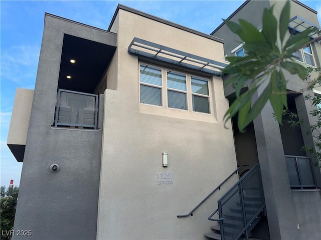 11257 Rainbow Peak Ave Unit 201, Las Vegas, NV 89135 - view of side of property featuring stucco siding