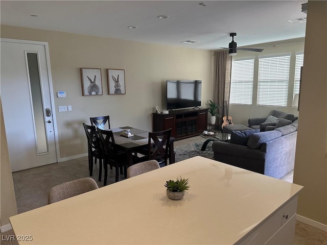 11257 Rainbow Peak Ave Unit 201, Las Vegas, NV 89135 - living room featuring light tile patterned floors, ceiling fan, visible vents, and baseboards