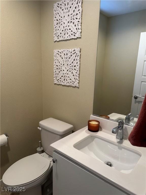 11257 Rainbow Peak Ave Unit 201, Las Vegas, NV 89135 - bathroom featuring toilet and vanity