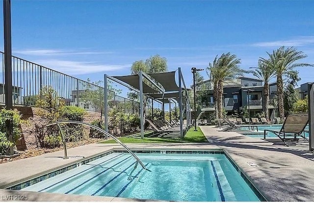 11257 Rainbow Peak Ave Unit 201, Las Vegas, NV 89135 - community pool with a patio