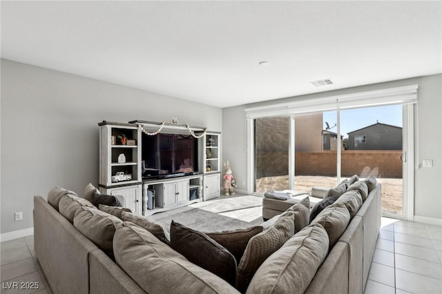 4630 Adonis Blue St, North Las Vegas, NV 89031 - living area featuring baseboards and light tile patterned floors