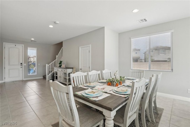 4630 Adonis Blue St, North Las Vegas, NV 89031 - dining room with light tile patterned floors, stairs, baseboards, and recessed lighting