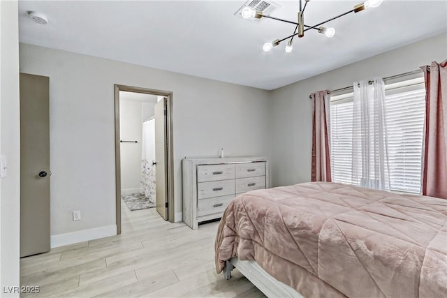 5045 Sock Hop Way N, Las Vegas, NV 89031 - bedroom with light wood-style floors and a chandelier