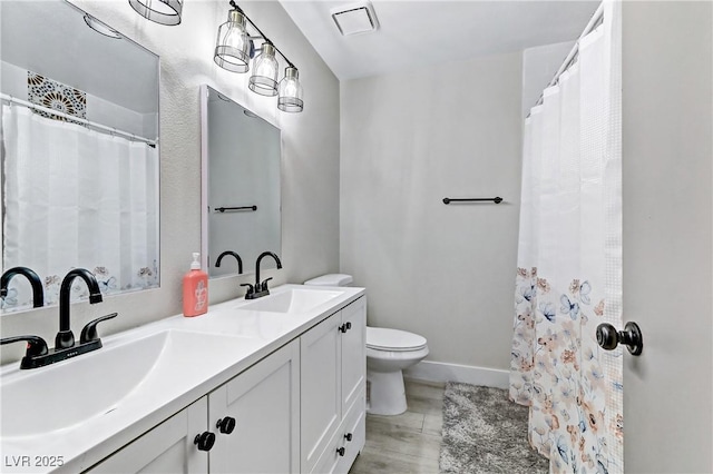 5045 Sock Hop Way N, Las Vegas, NV 89031 - bathroom with double vanity and a shower with shower curtain