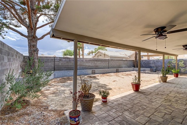 5045 Sock Hop Way N, Las Vegas, NV 89031 - fenced backyard featuring ceiling fan and a patio