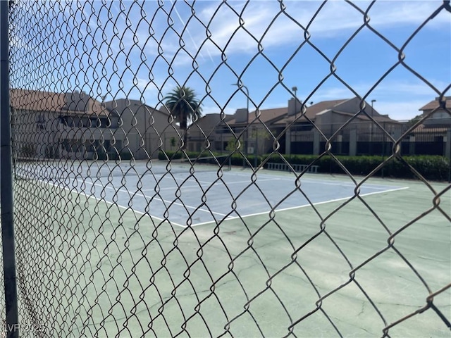 view of sport court with fence