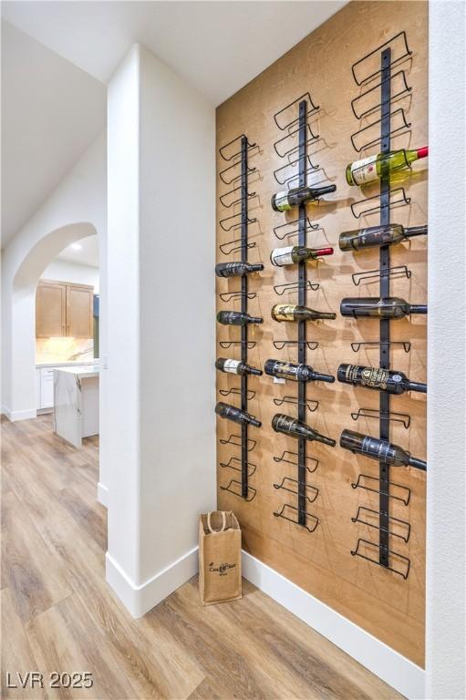 2571 Red Springs Dr, Las Vegas, NV 89135 - wine cellar featuring baseboards, wood finished floors, and arched walkways