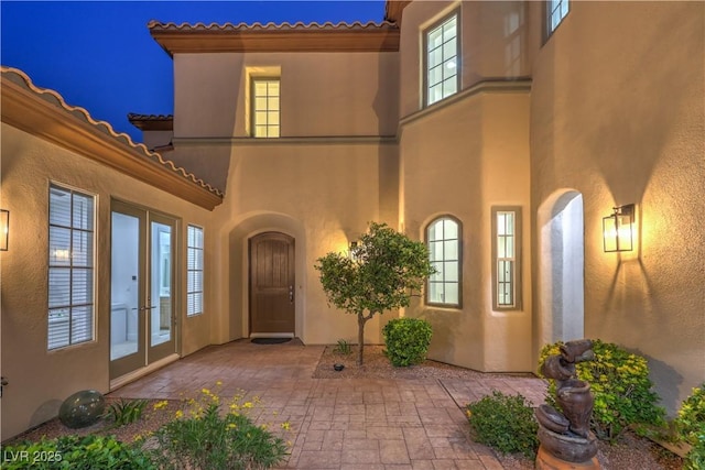 2571 Red Springs Dr, Las Vegas, NV 89135 - entrance to property with a tile roof, a patio, stucco siding, and french doors