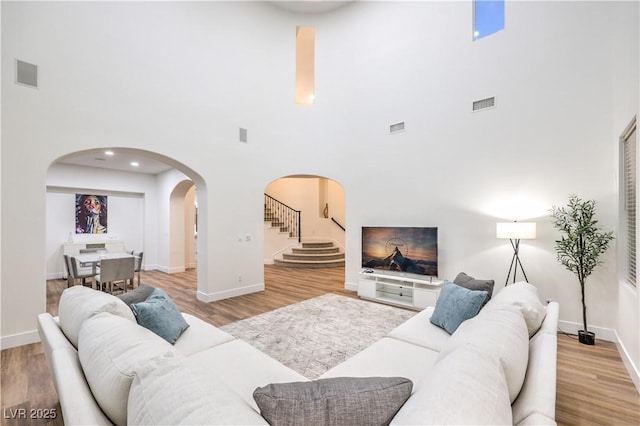 2571 Red Springs Dr, Las Vegas, NV 89135 - living area featuring visible vents, a high ceiling, and arched walkways