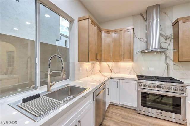 2571 Red Springs Dr, Las Vegas, NV 89135 - kitchen featuring a sink, backsplash, wall chimney range hood, light countertops, and appliances with stainless steel finishes