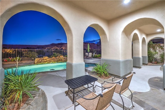 2571 Red Springs Dr, Las Vegas, NV 89135 - view of patio with fence, a mountain view, and a fenced in pool