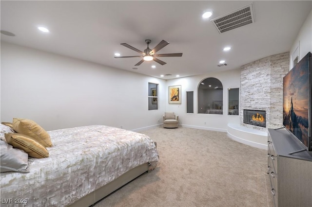 2571 Red Springs Dr, Las Vegas, NV 89135 - bedroom with recessed lighting, visible vents, a stone fireplace, carpet, and baseboards