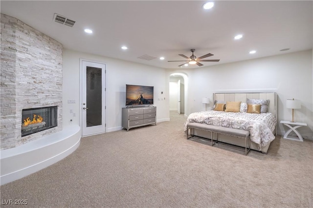 2571 Red Springs Dr, Las Vegas, NV 89135 - bedroom featuring visible vents, arched walkways, recessed lighting, a fireplace, and carpet