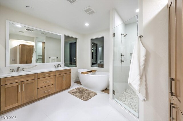 2571 Red Springs Dr, Las Vegas, NV 89135 - full bathroom featuring a stall shower, a sink, a soaking tub, and visible vents