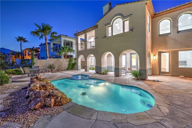 2571 Red Springs Dr, Las Vegas, NV 89135 - view of swimming pool with fence, a patio area, and a pool with connected hot tub