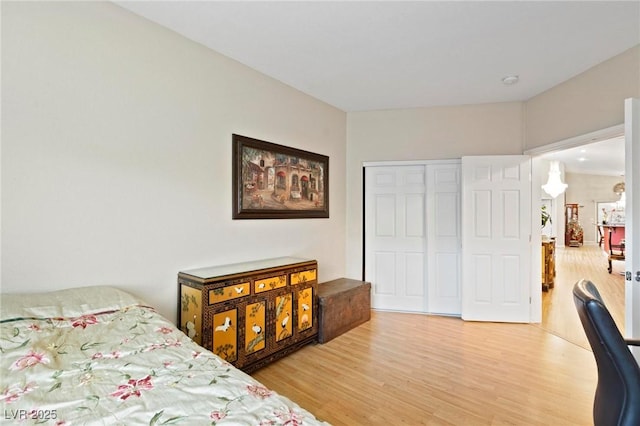 bedroom with a closet and light wood-style floors