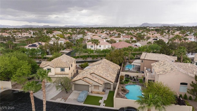 aerial view featuring a mountain view and a residential view