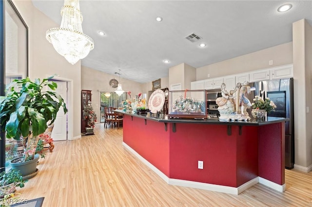 reception area featuring an inviting chandelier and visible vents