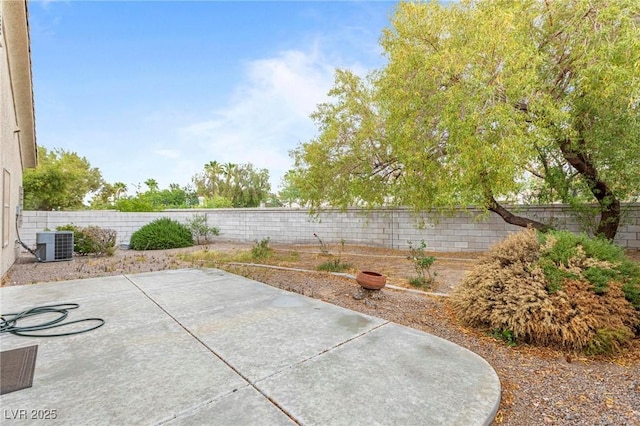view of patio / terrace with cooling unit and a fenced backyard